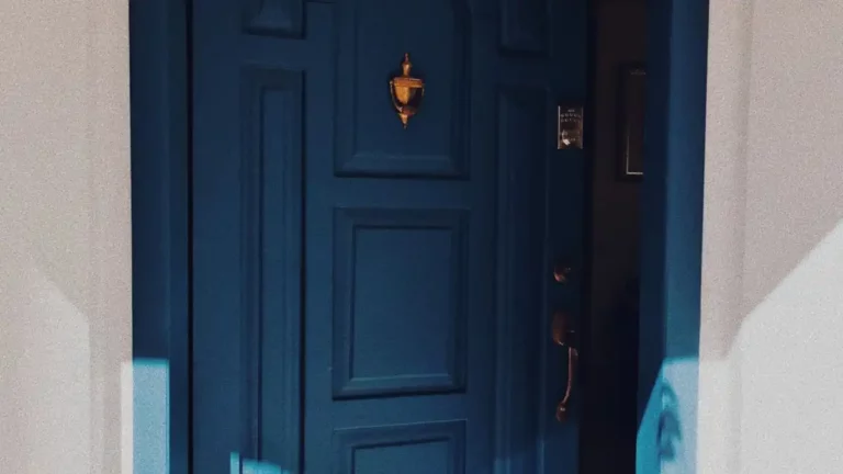 Stylish blue door with shadows