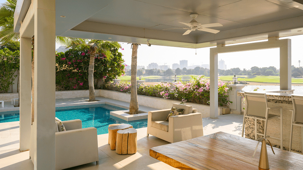 Outdoor patio with pool and seating area