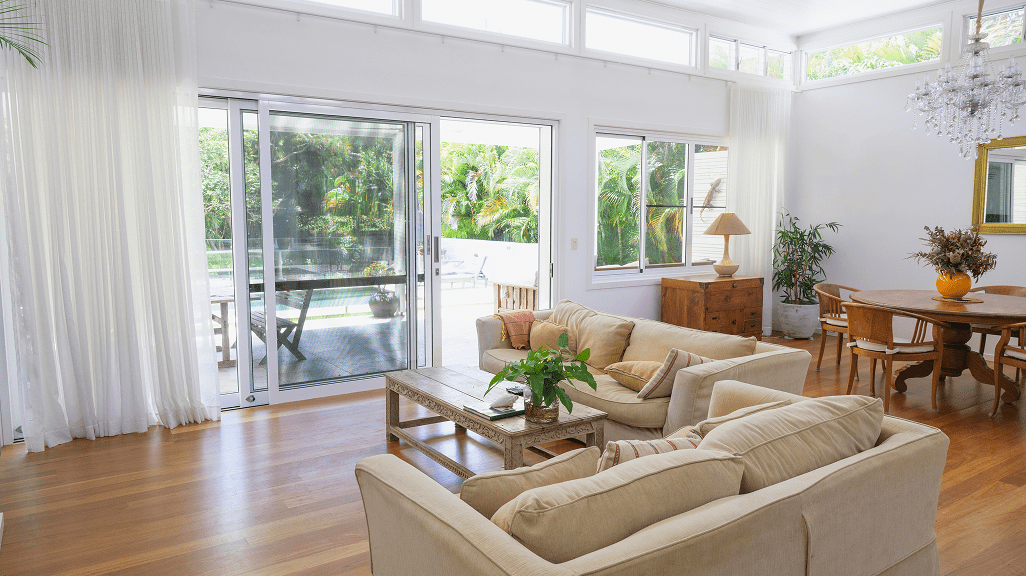 Bright living room with beige sofas